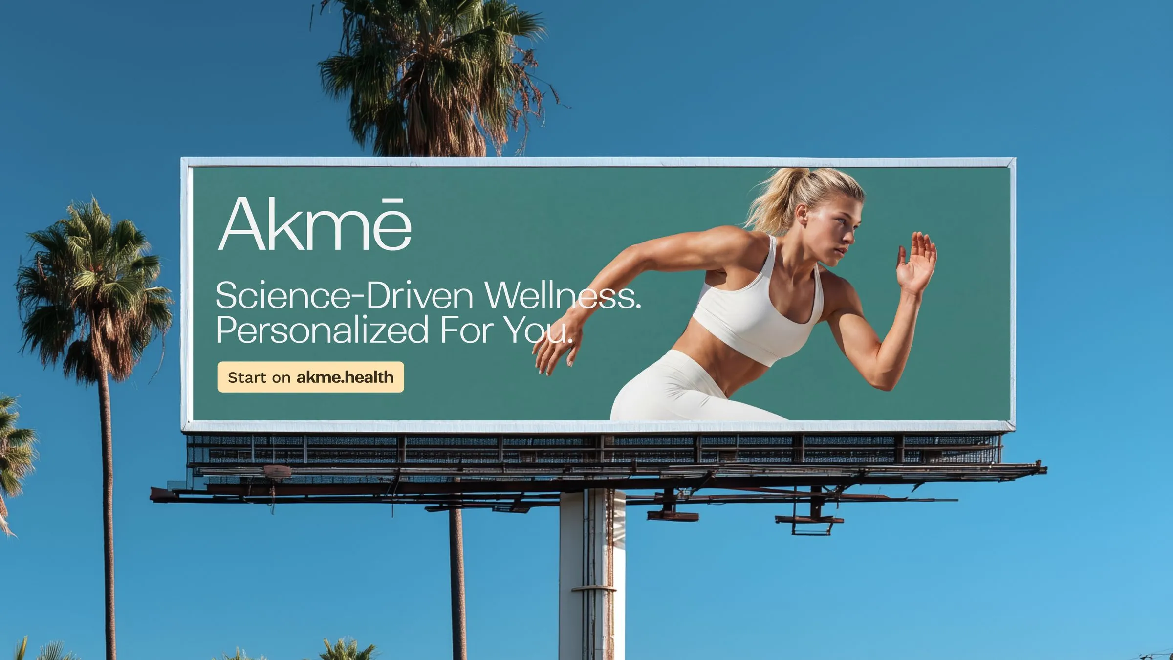Akmē billboard against a blue sky with palm trees